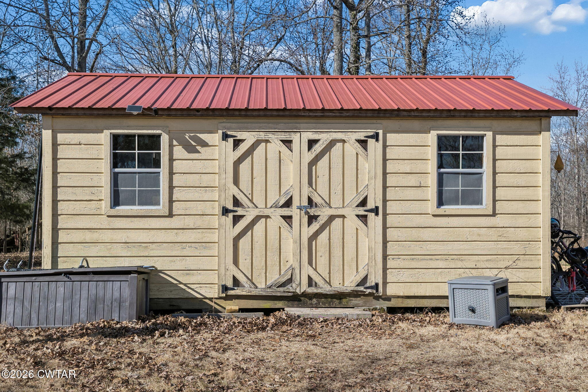 485 Lower Roans Creek Road Linden, TN 37096 - Photo 45 of 54 a view of a house with a bed and wooden fence