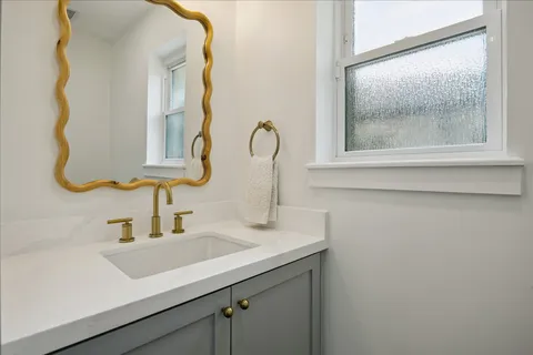 a sink with a mirror
