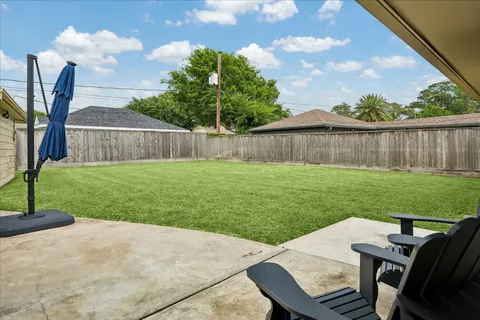 a view of a backyard with furniture
