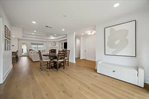 a view of a living room and dining room
