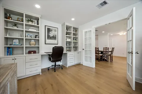 a view of a workspace with furniture