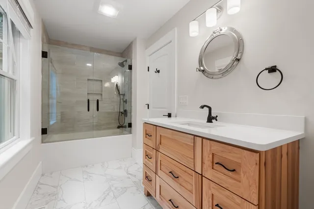 a living room with a fireplace and a flat screen tv