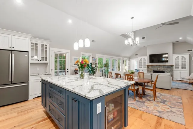 a kitchen with granite countertop a sink appliances and center island