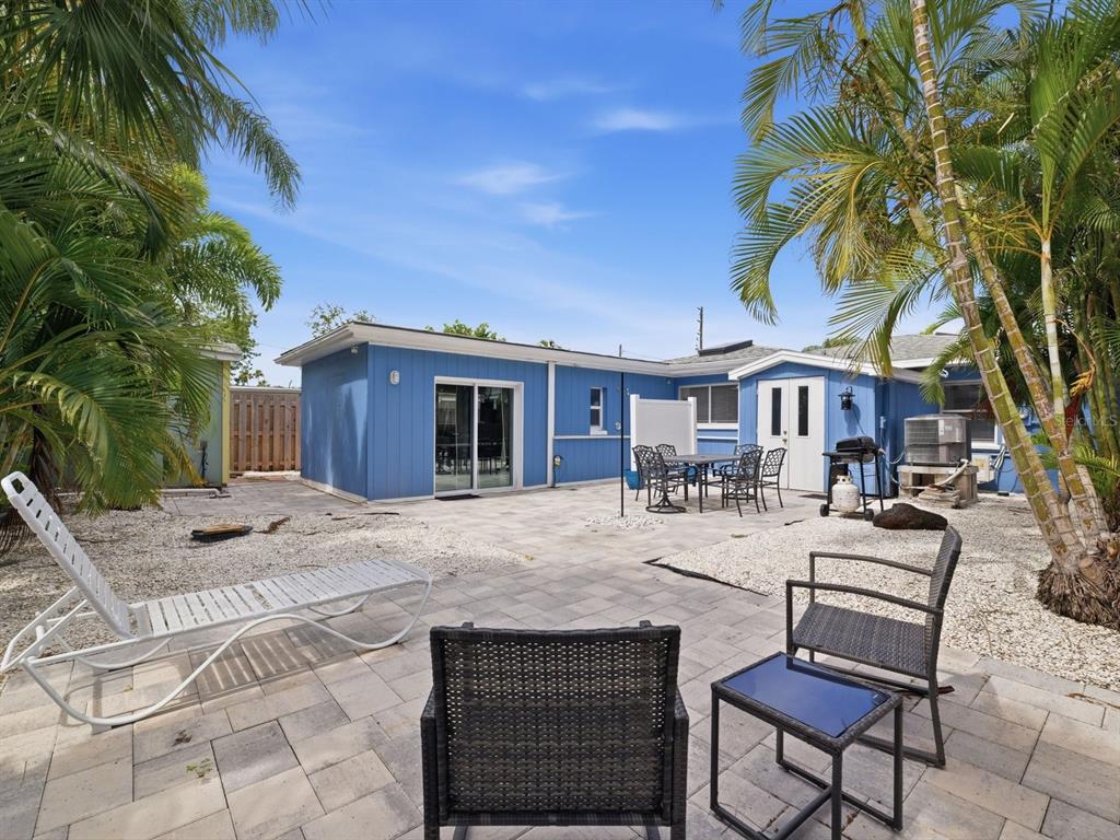 1207 1st Street Indian Rocks Beach, FL 33785 - Photo 35 of 60 a view of a house with backyard and sitting area