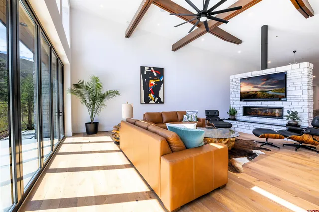 a living room with furniture and a flat screen tv