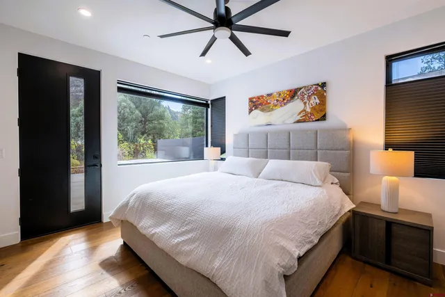 a bedroom with a large bed and a window