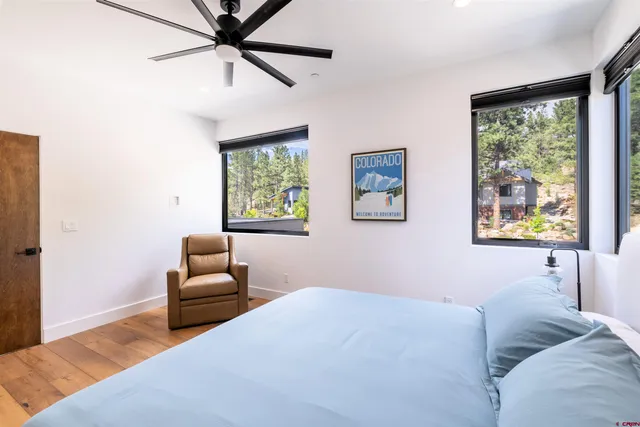 a bedroom with furniture and a window