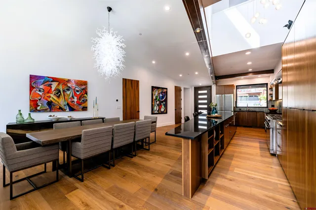 a living room with lots of furniture and a chandelier