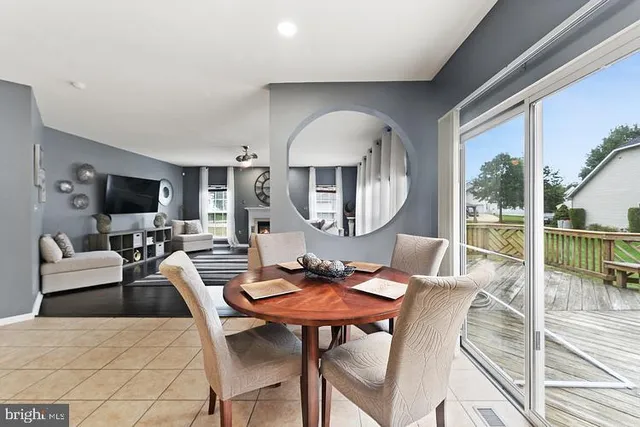 a living room with furniture fireplace and a flat screen tv