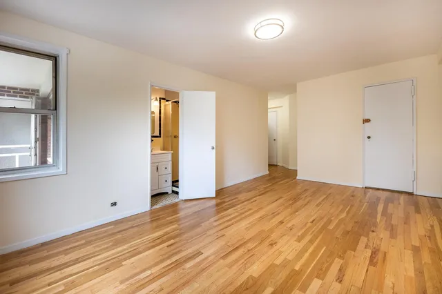 a kitchen with stainless steel appliances granite countertop a refrigerator a stove and a sink