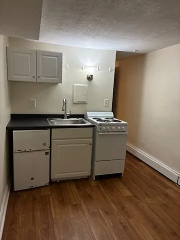 a kitchen with a stove and a microwave