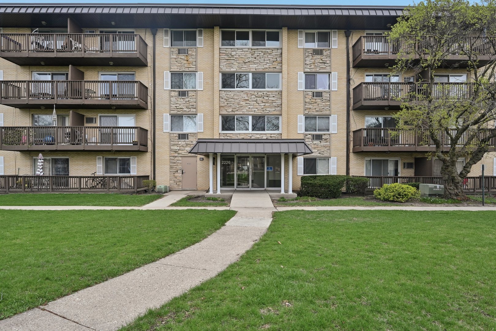 a front view of building with yard