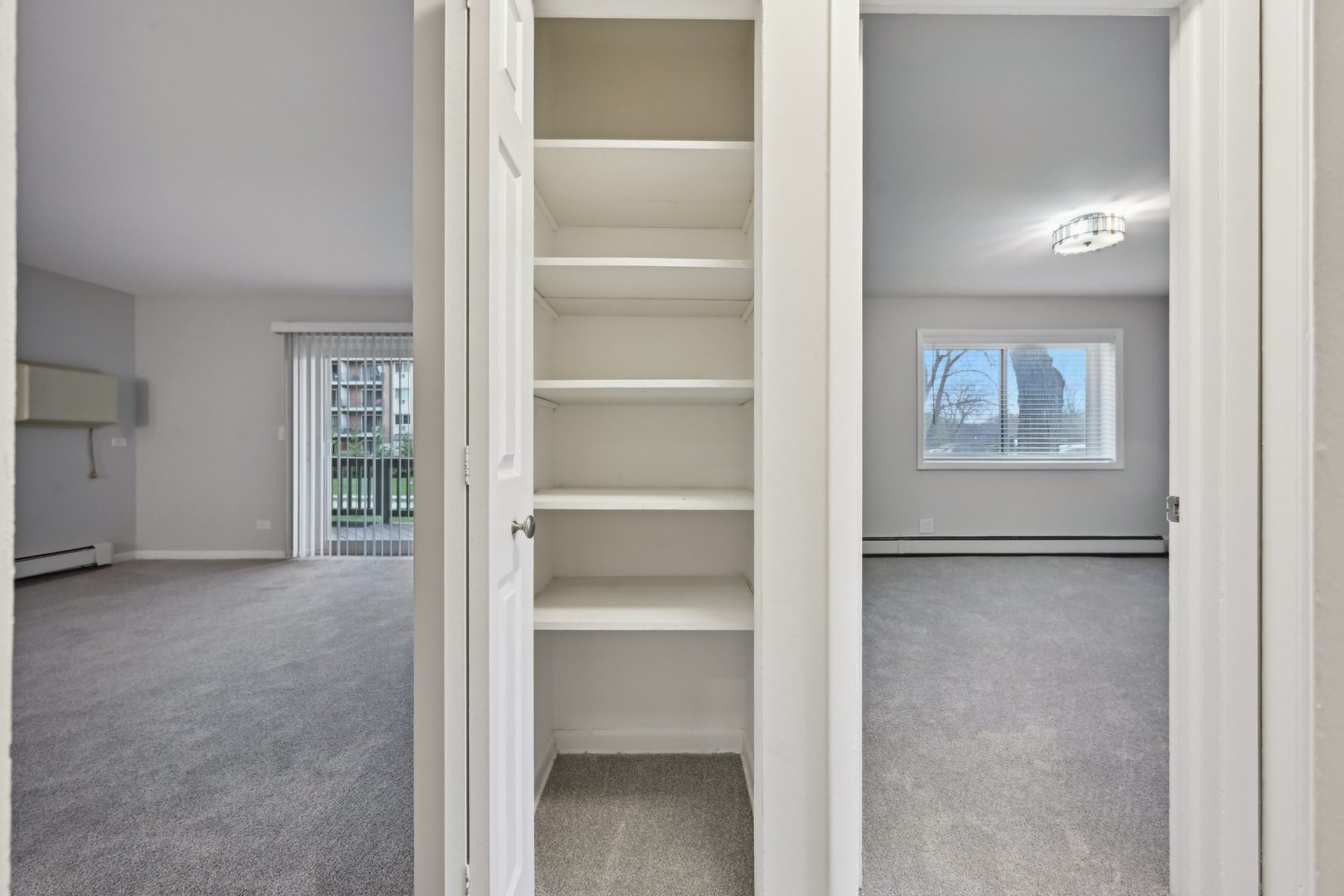 2226 South Goebbert Road, Unit 172 Arlington Heights, IL 60005 - Photo 12 of 22 a view of an empty room with closet and a window