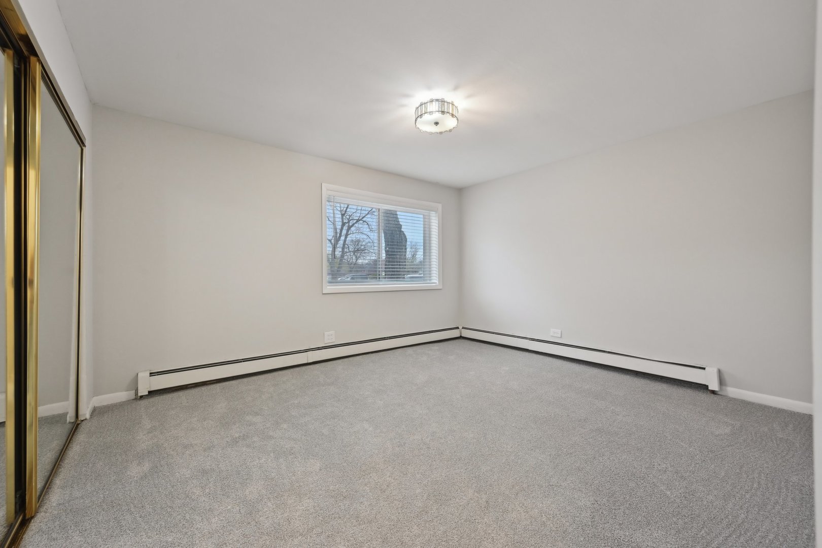 2226 South Goebbert Road, Unit 172 Arlington Heights, IL 60005 - Photo 13 of 22 an empty room with a window