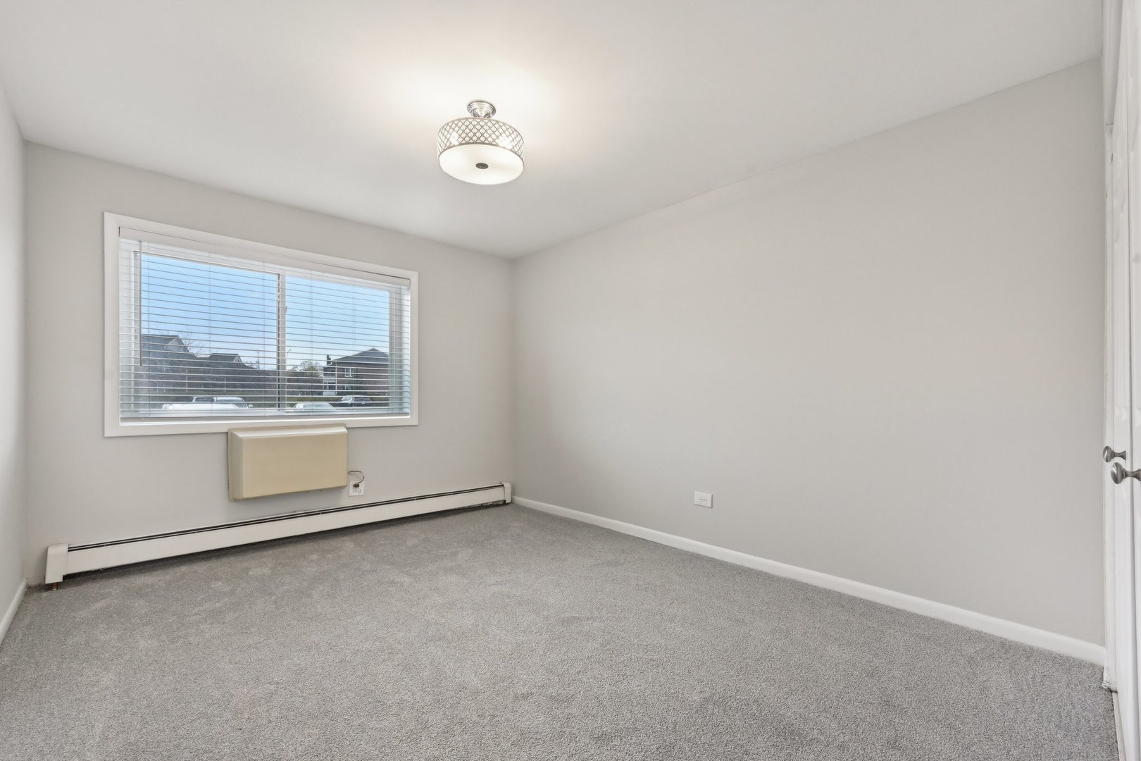 2226 South Goebbert Road, Unit 172 Arlington Heights, IL 60005 - Photo 16 of 22 an empty room with a empty space and windows