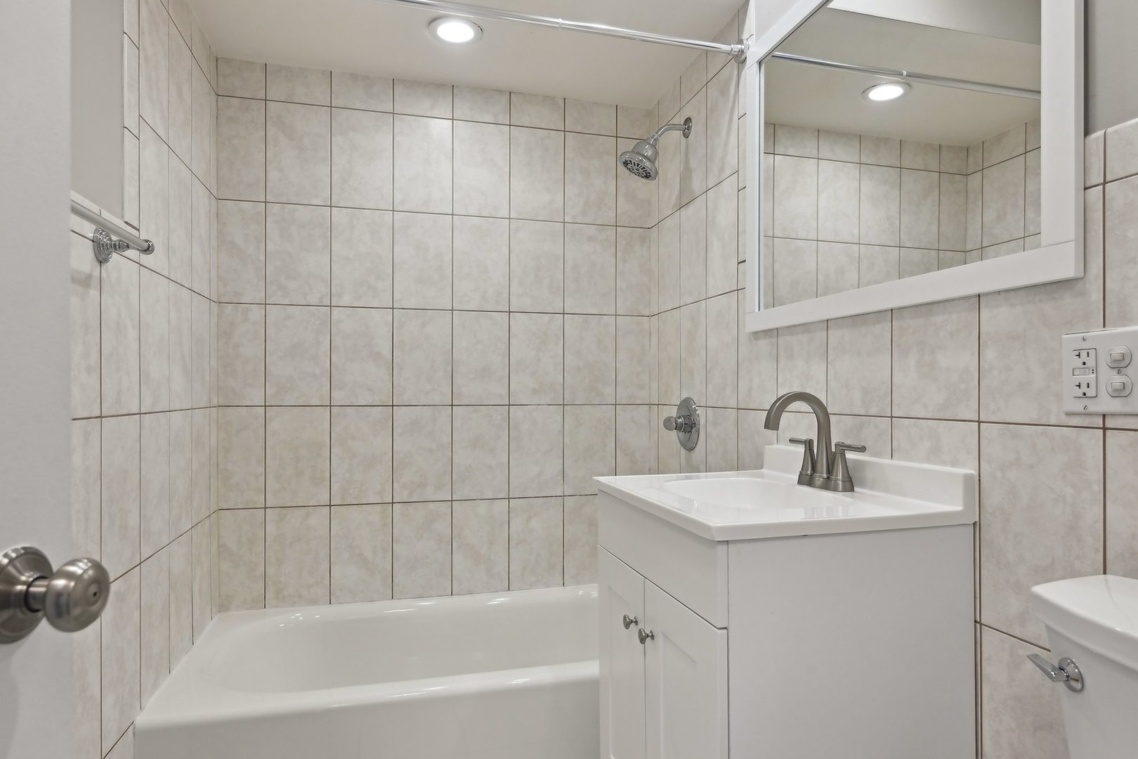 2226 South Goebbert Road, Unit 172 Arlington Heights, IL 60005 - Photo 18 of 22 a bathroom with a sink toilet and shower