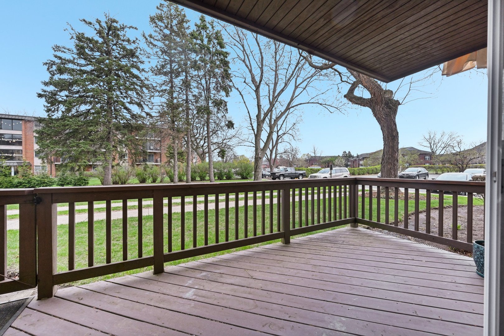 2226 South Goebbert Road, Unit 172 Arlington Heights, IL 60005 - Photo 19 of 22 a view of balcony with wooden floor and fence