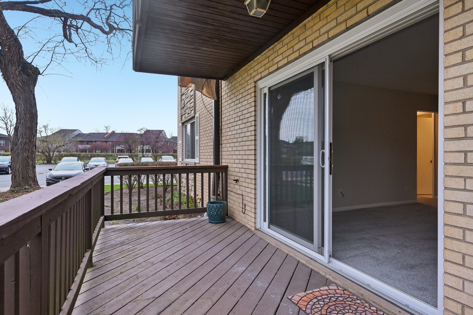 2226 South Goebbert Road, Unit 172 Arlington Heights, IL 60005 - Photo 20 of 22 a view of a balcony with wooden floor