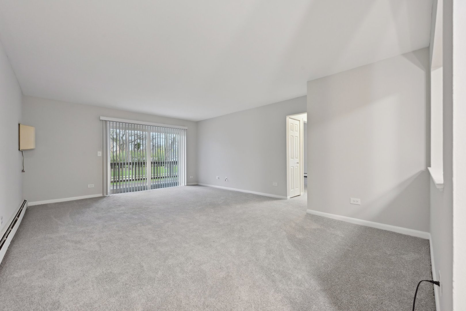 2226 South Goebbert Road, Unit 172 Arlington Heights, IL 60005 - Photo 5 of 22 a view of an empty room with a window