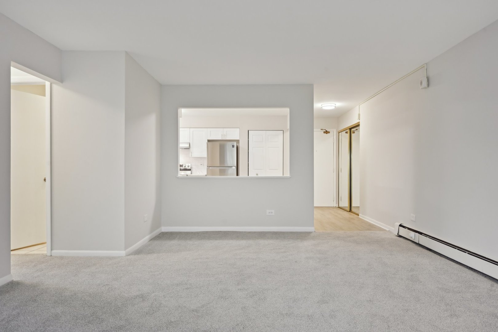 2226 South Goebbert Road, Unit 172 Arlington Heights, IL 60005 - Photo 7 of 22 a view of an empty room with a window