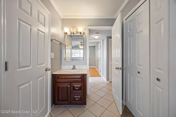 a large bathroom with a sink and a mirror