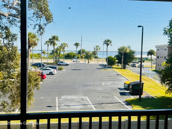 a view of swimming pool from a balcony