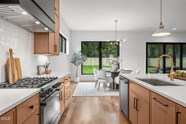 an empty room with a window and a ceiling fan