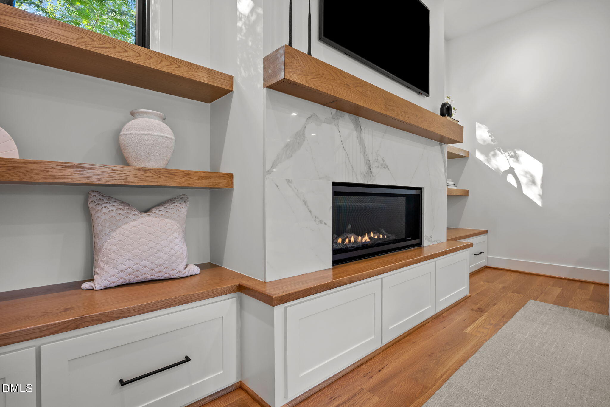 406 Columbia Drive Raleigh, NC 27604 - Photo 19 of 47 a kitchen with white cabinets and a fireplace