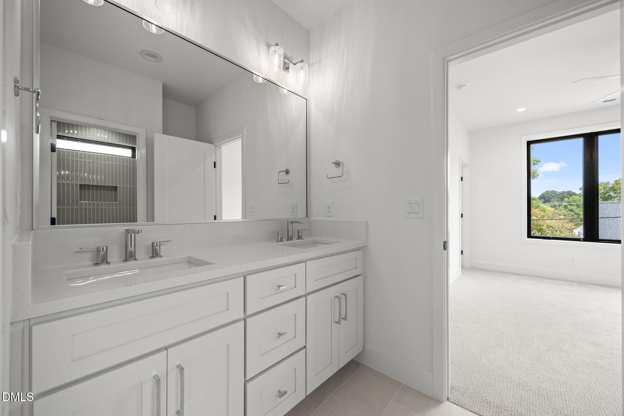406 Columbia Drive Raleigh, NC 27604 - Photo 40 of 47 a bathroom with double sink and a mirror
