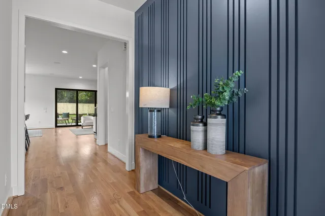a kitchen with white cabinets and a fireplace