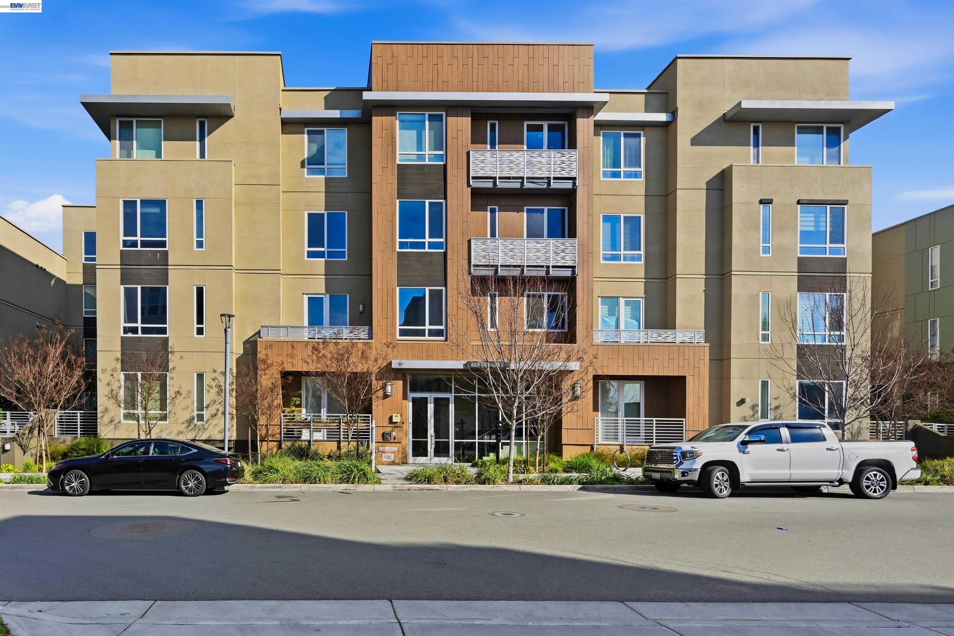 45378 Tom Blalock Street, Unit 403 Fremont, CA 94539 - Photo 1 of 1 a car parked in front of a building