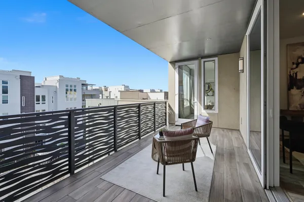 a view of balcony with furniture