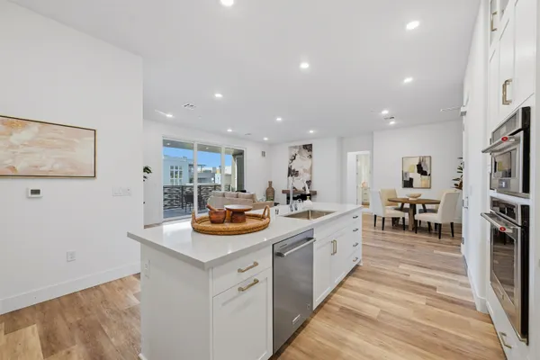 a kitchen with counter and chairs