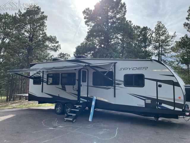 34135 Berndt Road Yoder, CO 80864 - Photo 19 of 24 a view of a patio with a yard