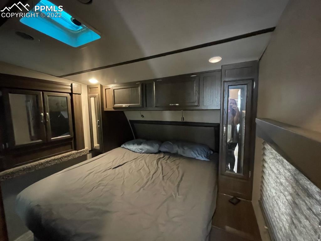 34135 Berndt Road Yoder, CO 80864 - Photo 8 of 24 a large room with a bed and wooden floor