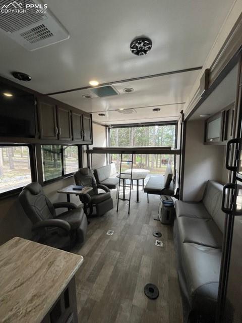 34135 Berndt Road Yoder, CO 80864 - Photo 9 of 24 a living room with furniture a window and gym equipment