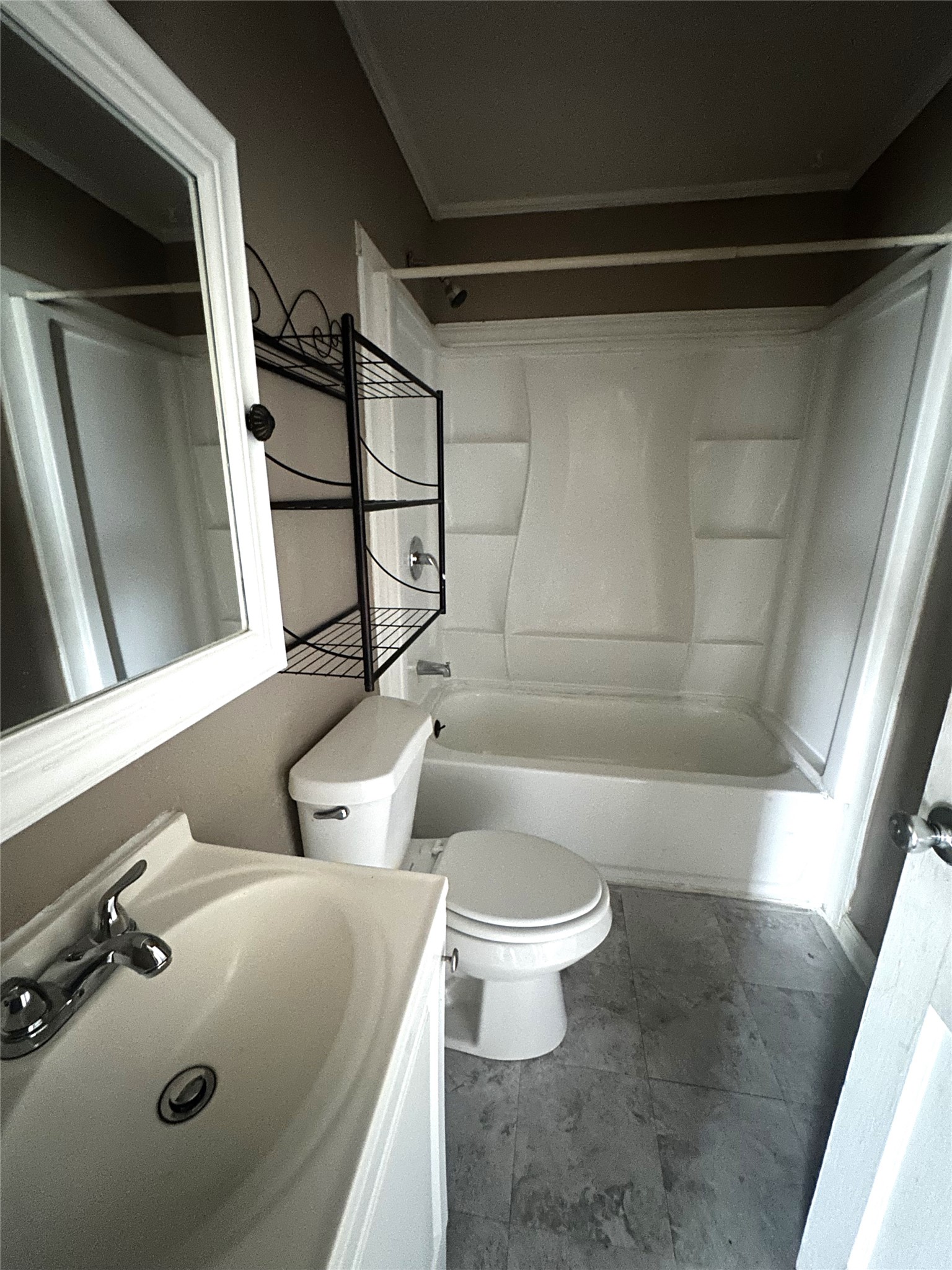 11005 Muscatine Street Houston, TX 77029 - Photo 9 of 12 a bathroom with a sink a toilet and shower