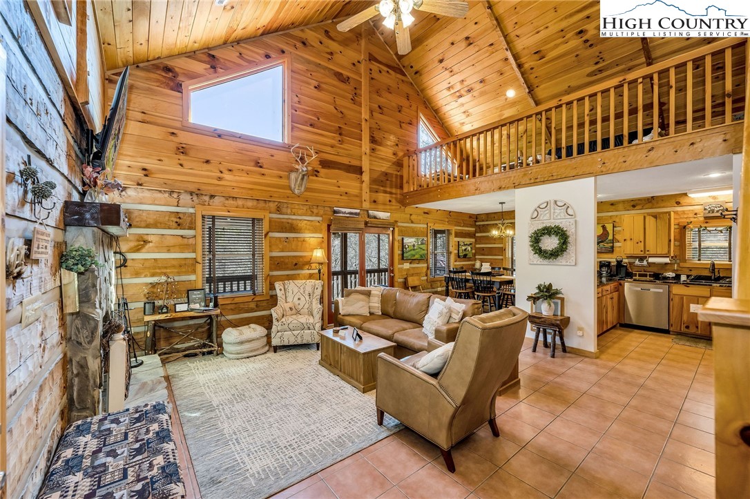 251 Stone Valley Road Grassy Creek, NC 28631 - Photo 15 of 46 a building outdoor space with patio furniture