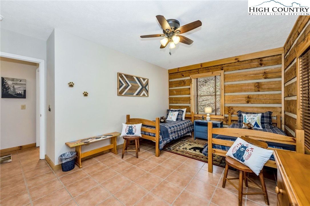 251 Stone Valley Road Grassy Creek, NC 28631 - Photo 19 of 46 a bedroom with furniture and a window