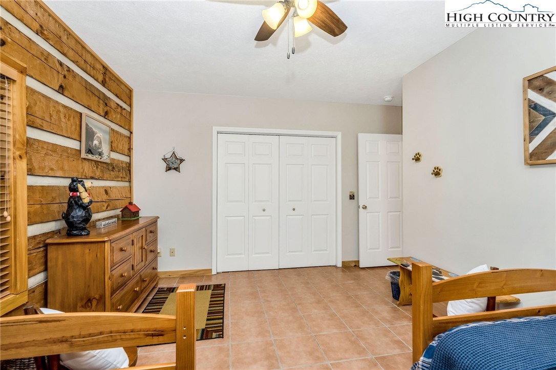 251 Stone Valley Road Grassy Creek, NC 28631 - Photo 20 of 46 a view of a livingroom with workspace and a window