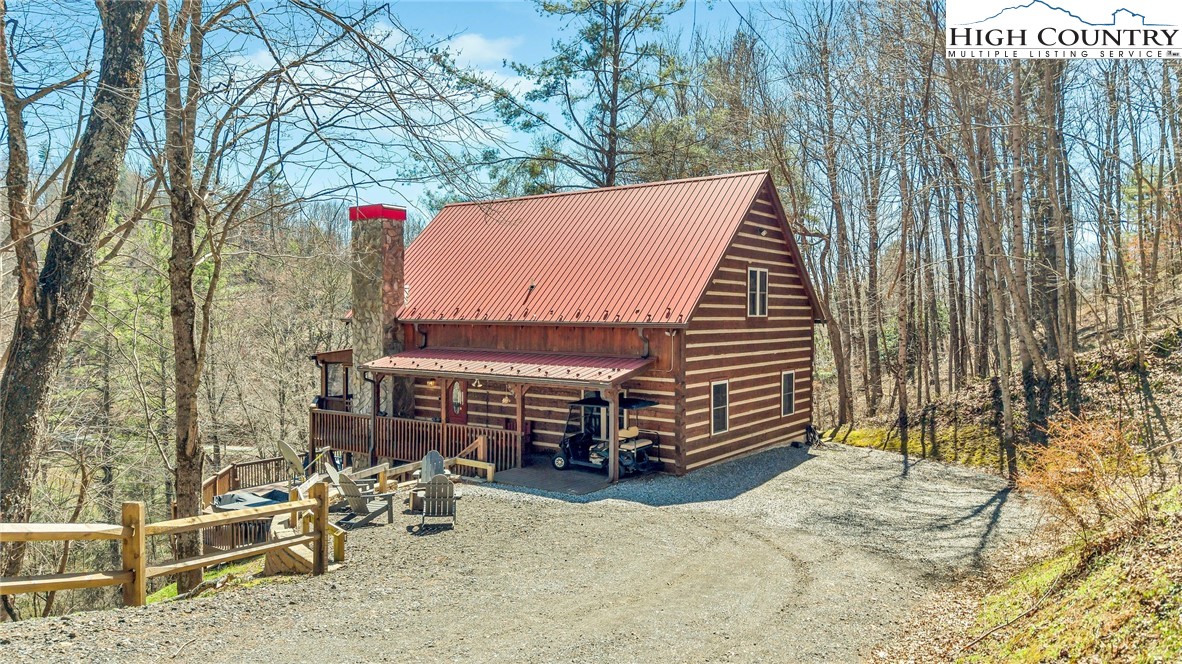251 Stone Valley Road Grassy Creek, NC 28631 - Photo 3 of 46 a backyard of a house with outdoor seating