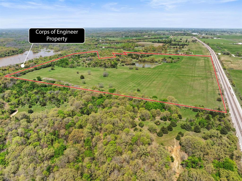 2 Hog Town Road Collinsville, TX 76233 - Photo 4 of 10 a view of a field with an ocean view