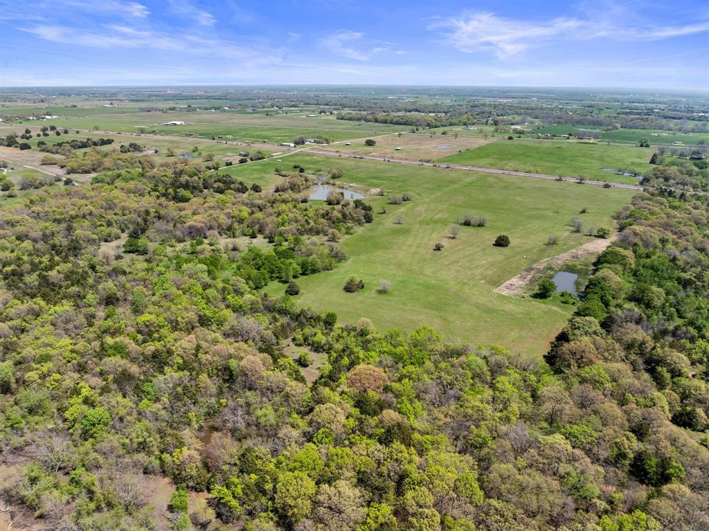 2 Hog Town Road Collinsville, TX 76233 - Photo 7 of 10 a view of a city with an ocean beach