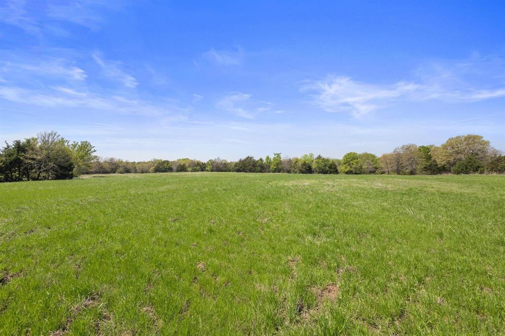 2 Hog Town Road Collinsville, TX 76233 - Photo 9 of 10 a view of a green field with clear sky