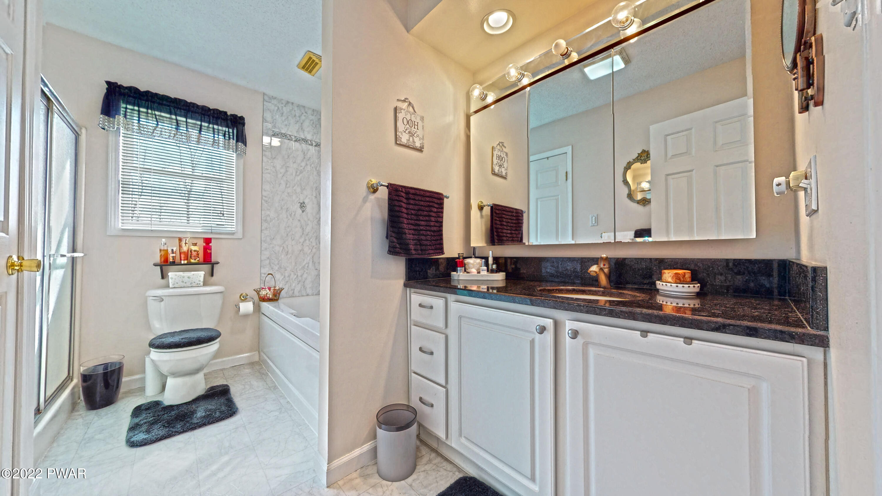 80 Boulder Road Lake Ariel, PA 18436 - Photo 25 of 59 a bathroom with a toilet sink and mirror