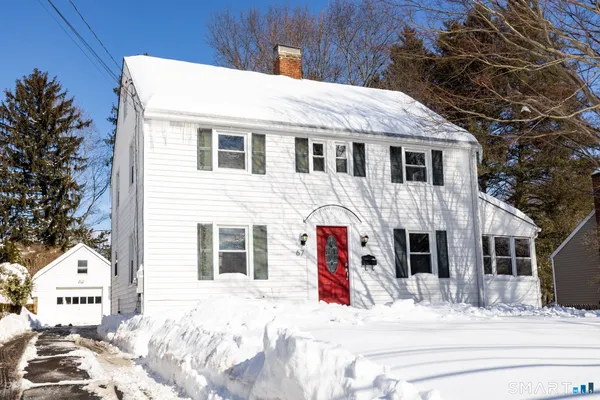 a white building that has a sign on it