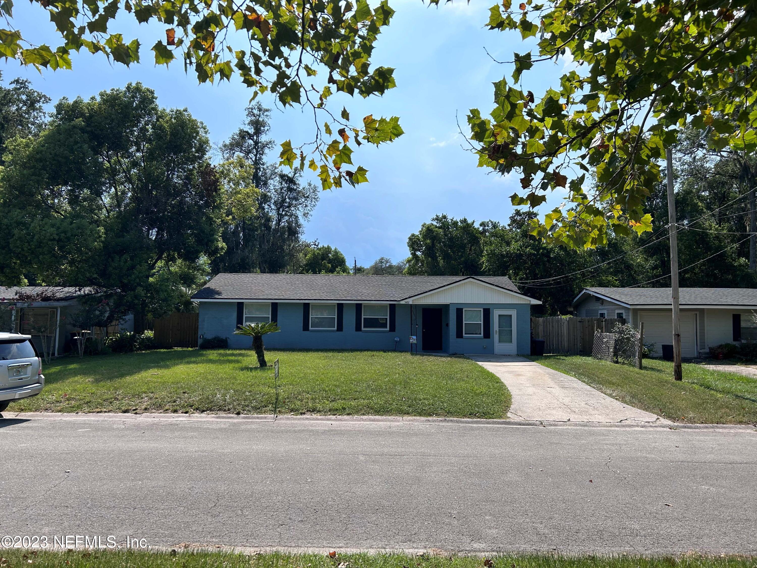 5452 Community Road Jacksonville, FL 32207 - Photo 1 of 23 front view of a house with a small yard