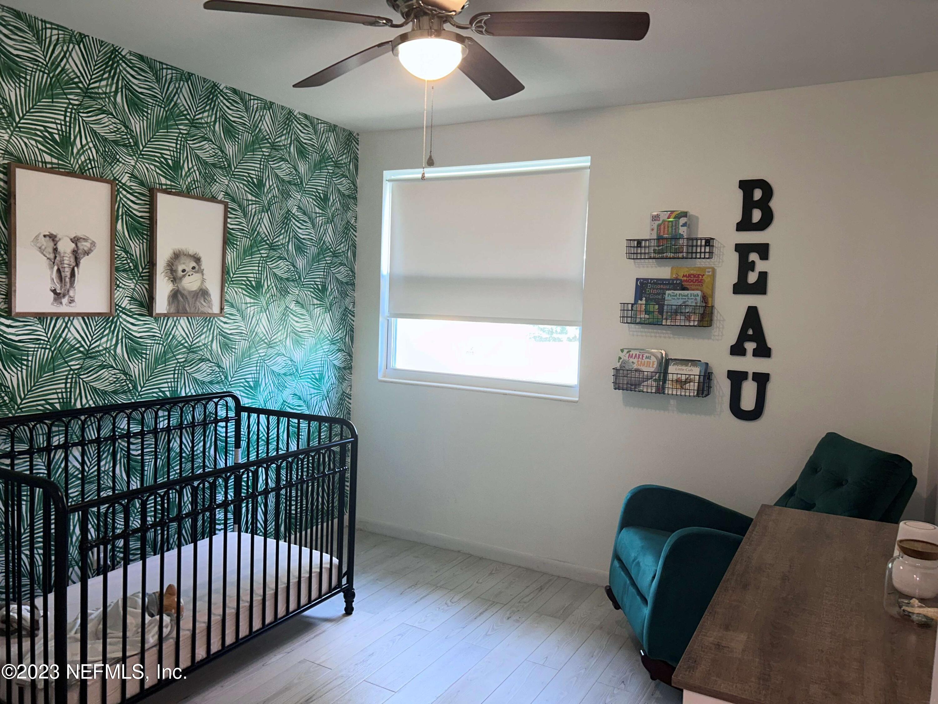 5452 Community Road Jacksonville, FL 32207 - Photo 12 of 23 a bedroom with a bed and window