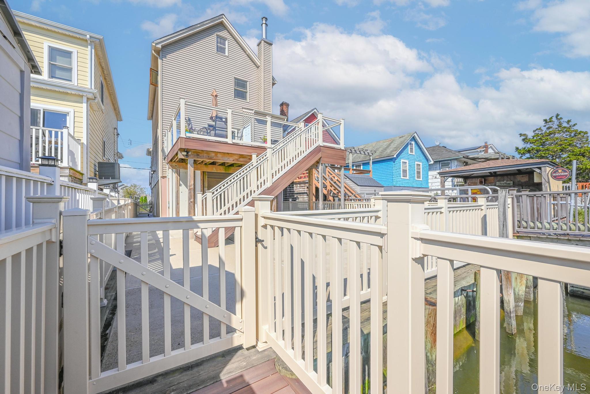 20 West 18th Road Queens, NY 11693 - Photo 10 of 41 a view of a houses with city from a terrace