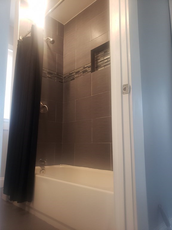19 Wareham Street Springfield, MA 01108 - Photo 12 of 25 a bathroom with a bathtub
